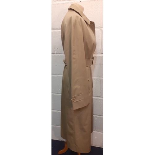 14 - Burberrys for Harrods- A beige raincoat with iconic tartan lining having 2 internal pockets, hardly ... 