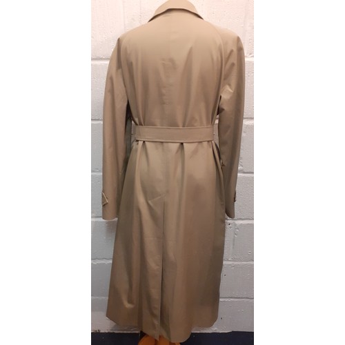 14 - Burberrys for Harrods- A beige raincoat with iconic tartan lining having 2 internal pockets, hardly ... 