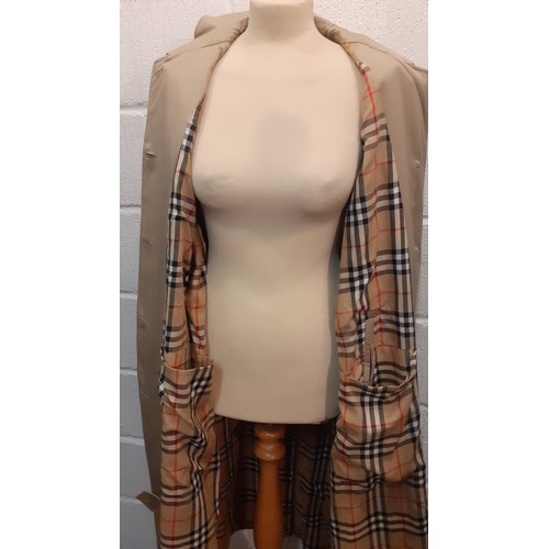 14 - Burberrys for Harrods- A beige raincoat with iconic tartan lining having 2 internal pockets, hardly ... 