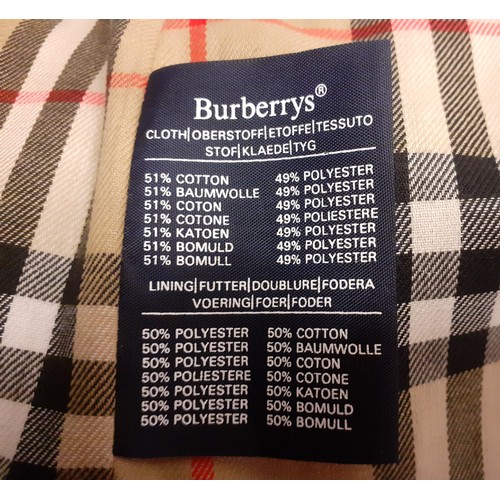 14 - Burberrys for Harrods- A beige raincoat with iconic tartan lining having 2 internal pockets, hardly ... 