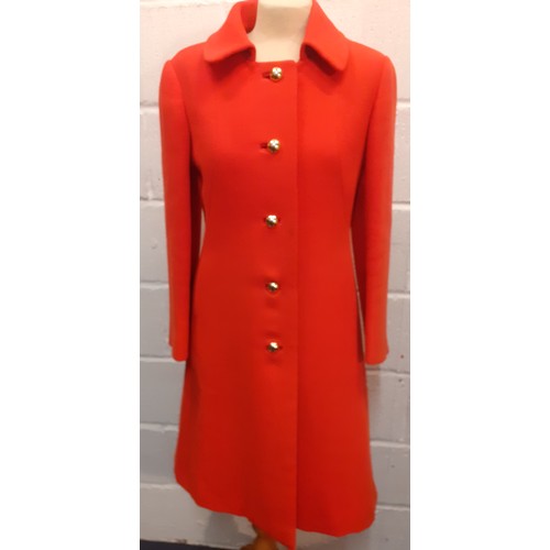 15 - Aquascutum for Harrods- A 1970's ladies orange/red fitted coat having 2 side pockets with 5 gold col... 