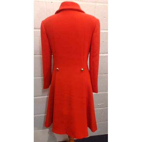 15 - Aquascutum for Harrods- A 1970's ladies orange/red fitted coat having 2 side pockets with 5 gold col... 