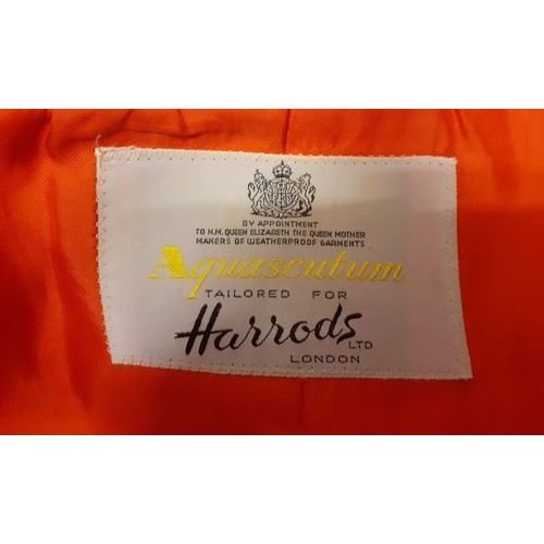 15 - Aquascutum for Harrods- A 1970's ladies orange/red fitted coat having 2 side pockets with 5 gold col... 