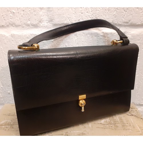 135 - A group of mainly 1960's and 70's ladies leather handbags, some having a water silk lining to includ... 