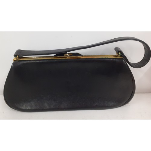 138 - Three good quality vintage bags comprising a Harrods black leather with gold tone hardware handbag, ... 