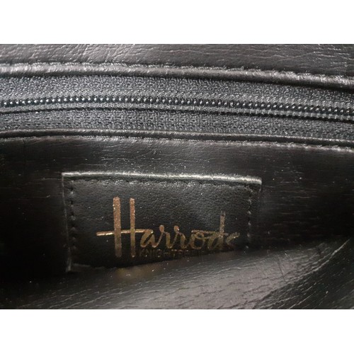 138 - Three good quality vintage bags comprising a Harrods black leather with gold tone hardware handbag, ... 