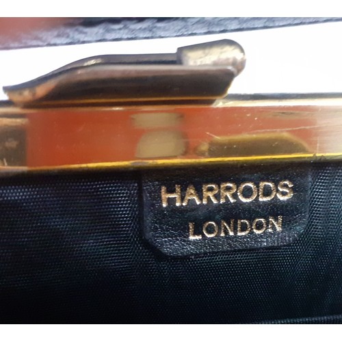 138 - Three good quality vintage bags comprising a Harrods black leather with gold tone hardware handbag, ... 