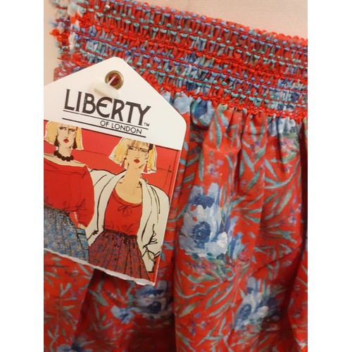 148 - Liberty-Three 1970's Liberty ladies blouses UK18, together with a Liberty skirt, unfinished requirin... 