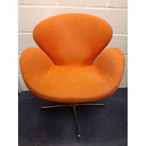 198 - A 20th Century Arne Jacobsen style Swan chair having original orange upholstery on a chrome swivel b... 