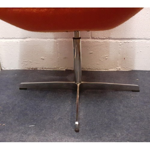 198 - A 20th Century Arne Jacobsen style Swan chair having original orange upholstery on a chrome swivel b... 