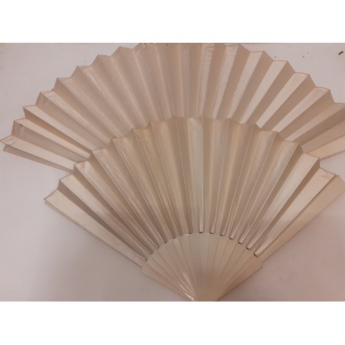 162 - Two Victorian bone and cream silk fans, one hand-painted with a bird in-flight approaching a blossom... 