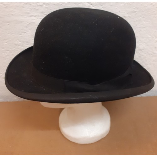 167 - A mid 20th Century Dunn & Co Ltd black felt bowler hat, size 7. Location: R2-1
Condition:Good, no ap... 