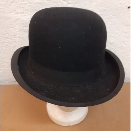 167 - A mid 20th Century Dunn & Co Ltd black felt bowler hat, size 7. Location: R2-1
Condition:Good, no ap... 