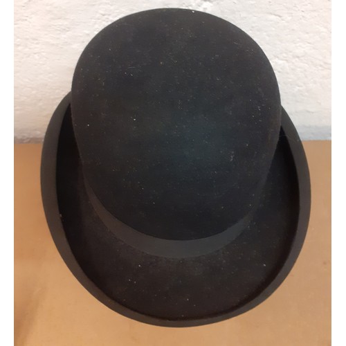 167 - A mid 20th Century Dunn & Co Ltd black felt bowler hat, size 7. Location: R2-1
Condition:Good, no ap... 