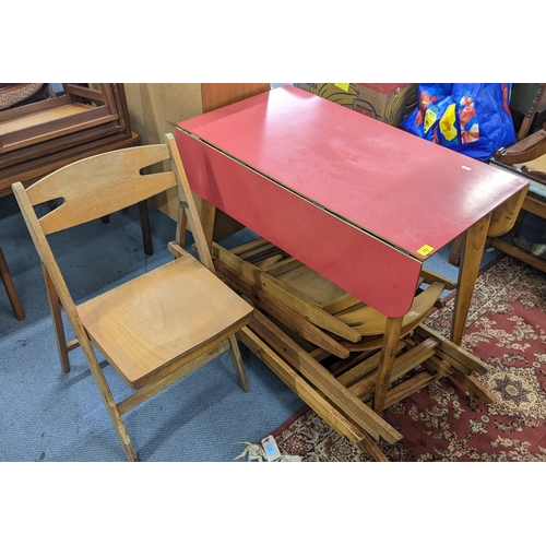 202 - A retro beech and Formica top fall flap table, 75cm h x 91cm w, together with a set of six folding c... 