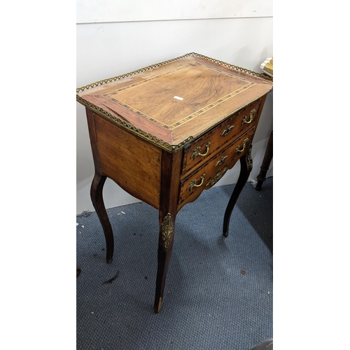 207 - A 19th century French side table having a pierced gallery top, mixed veneer and two drawers with gil... 