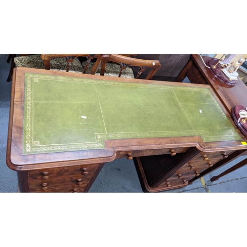 212 - A Victorian mahogany twin pedestal desk having a green leather topped scriber and nine drawers, 75.5... 