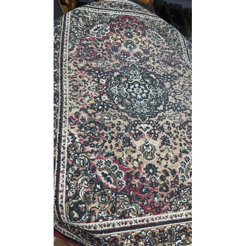 215 - Four rugs to include a Persian Heriz red ground rug with repeating motifs, 129cm x 107cm 
Location:A... 