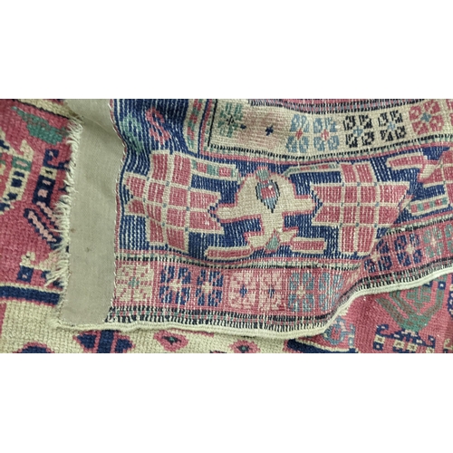 217 - A Turkish hand woven red ground runner having five central motifs and repeating pattern, 322cm x 140... 