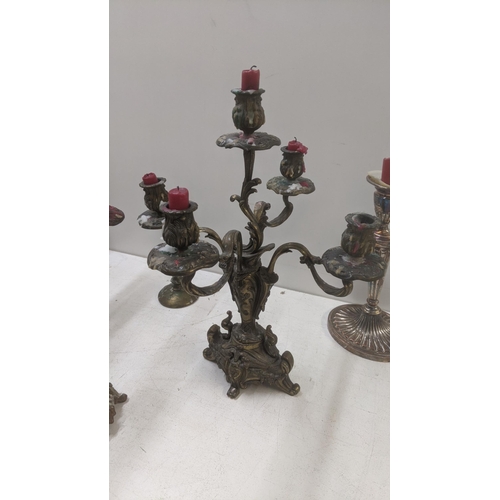 261 - Candlesticks to include a pair of mid 20th century brass ornate four branch candelabras
Location:LWB... 