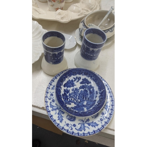 269 - A mixed lot of ceramics to include a Wedgewood fluted vase with be floral relief moulds together wit... 