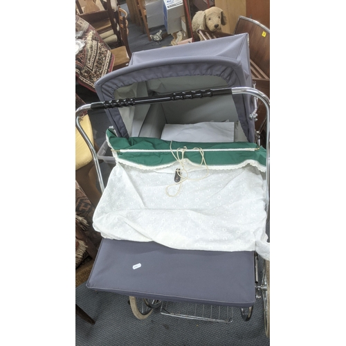 293 - A silver cross pram with white wheels, chrome chassis,  cream body and hood
Location:A1B
If there is... 