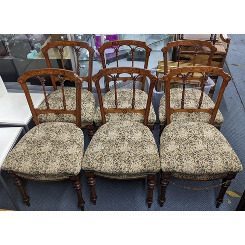 391 - A set of six Victorian walnut and marquetry inlaid dining chairs with spindle supports and tapering ... 