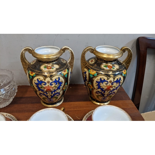 231 - A collection of ceramics and glassware to include a pair of Japanese Noritake vases, Oepiag Royal cu... 