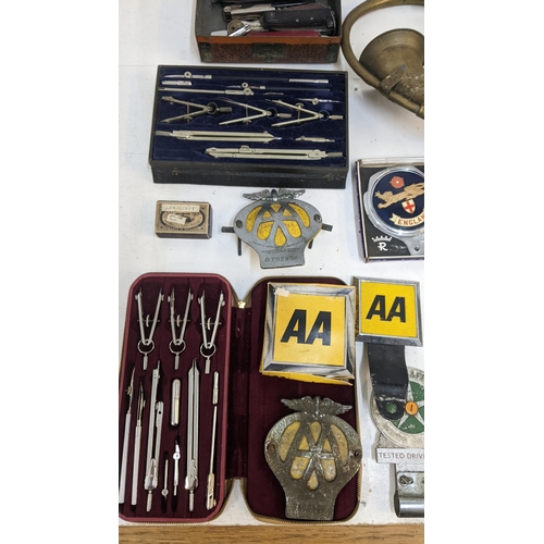 245 - A mixed lot to include a collection of motoring badges and AA related ephemera together with a vinta... 