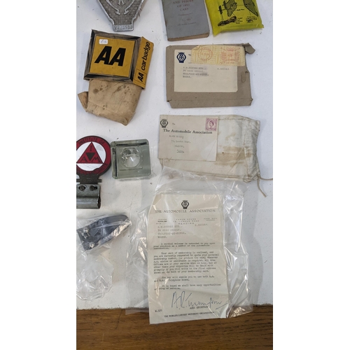 245 - A mixed lot to include a collection of motoring badges and AA related ephemera together with a vinta... 