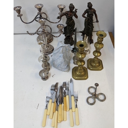 249 - A mixed lot of metalware to include a candelabra (one A/F) two Victorian Spelter figures, flatware a... 