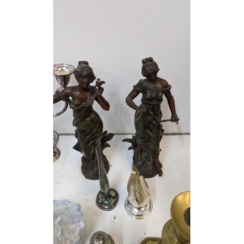 249 - A mixed lot of metalware to include a candelabra (one A/F) two Victorian Spelter figures, flatware a... 