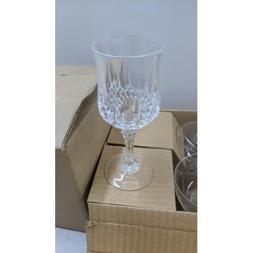 271 - Glassware to include crystal cut long champagne glasses, vases and coloured glass examples
Location:... 