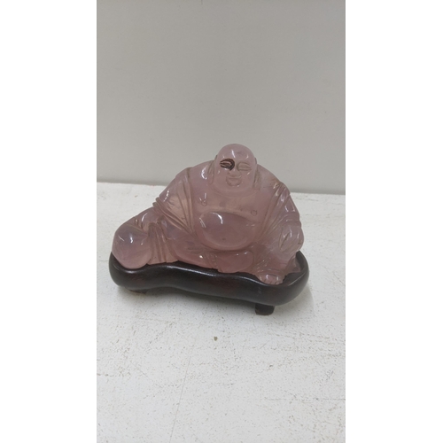 278 - A rose quartz Buddha on a wooden plinth, 8cm h x 10.5cm w
Location:6.1
If there is no condition repo... 