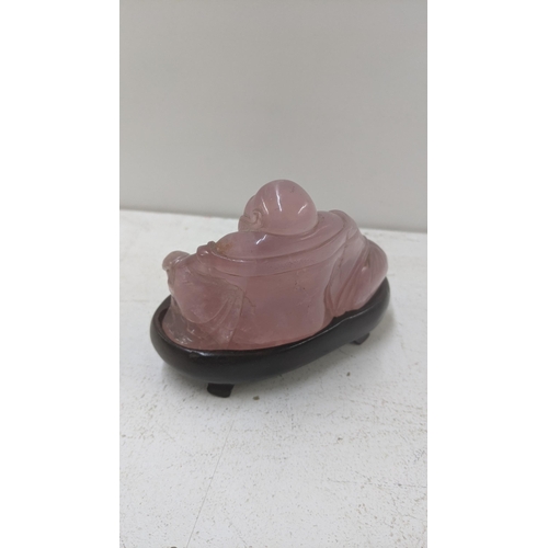 278 - A rose quartz Buddha on a wooden plinth, 8cm h x 10.5cm w
Location:6.1
If there is no condition repo... 