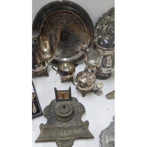 279 - A mixed lot of metalware, mostly silver plate together with a brass table top ink pot, a John Lewis ... 