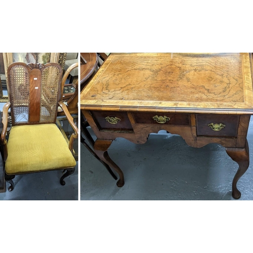 294 - An early 20th century Queen Anne revival walnut lowboy together with a can back armchair
Location:G
... 