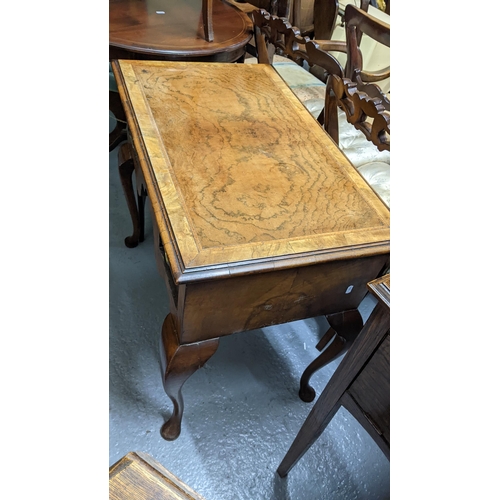 294 - An early 20th century Queen Anne revival walnut lowboy together with a can back armchair
Location:G
... 