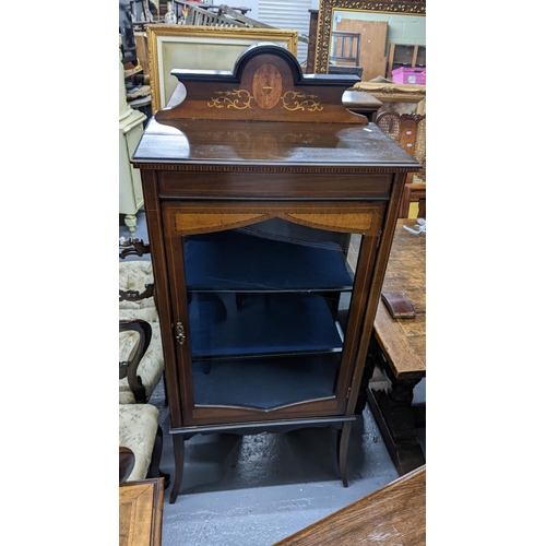 295 - An Edwardian mahogany and marquetry inlaid glass fronted display cabinet, 140cm h x 59.5cm w
Locatio... 