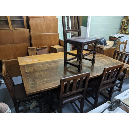 309 - 1930s oak refectory table with carved columns on block legs 77x183x86cmx, together with a set of fiv... 