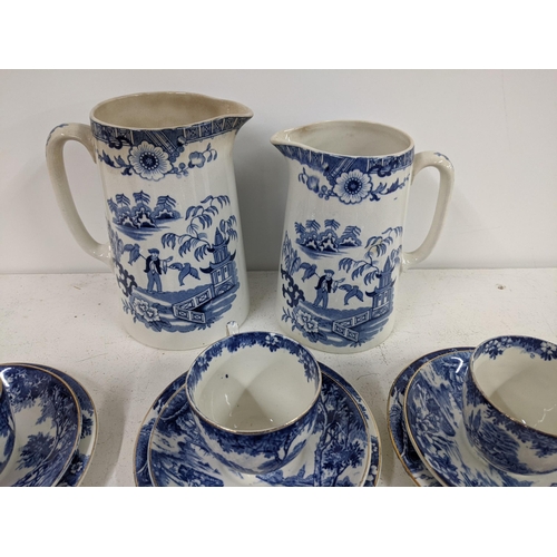 347 - A small lot of blue and white china comprising of two jugs, six plates, six saucers, six cups, five ... 