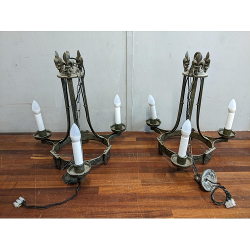 357 - A pair of wrought metal medieval style chandeliers, 48cm w
Location:G
If there is no condition repor... 