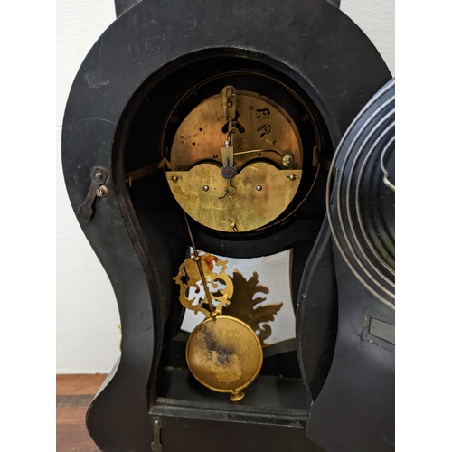 359 - A late 20th century reproduction ebonized and gilt metal French style clock surmounted by a figure L... 