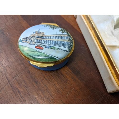 366 - A Crummles & Co limited edition enamelled box, with an image of Glaxo Pharmaceutical building to the... 