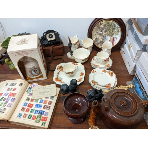 369 - Wedgwood and other picture plates, Bells whisky, stamp album, Bell and Howell cine camera and other ... 