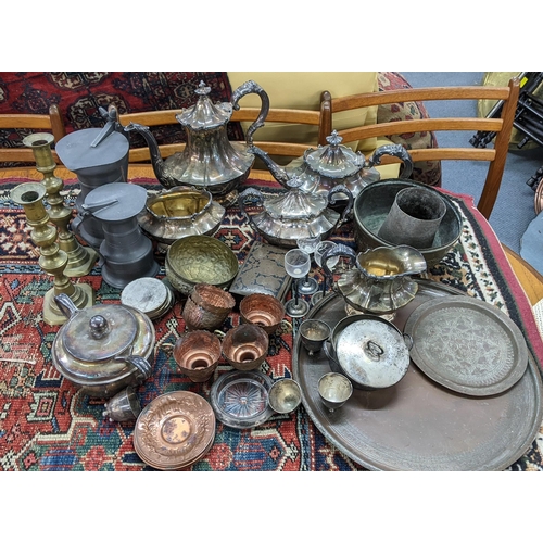 397 - Mixed metalware to include a silver plated tea service, pewter tankards, brass candlesticks and othe... 