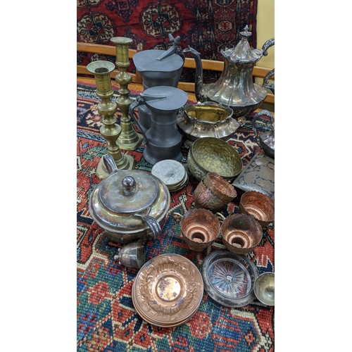 397 - Mixed metalware to include a silver plated tea service, pewter tankards, brass candlesticks and othe... 