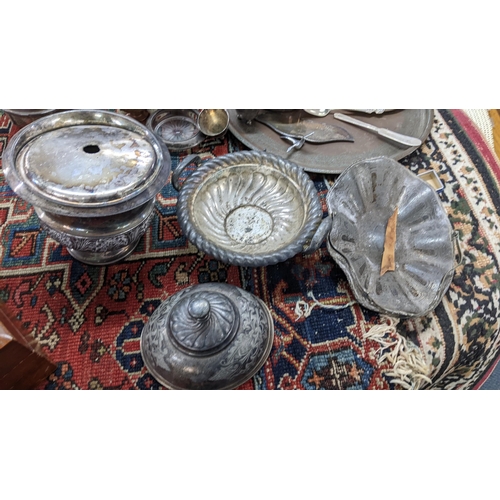 397 - Mixed metalware to include a silver plated tea service, pewter tankards, brass candlesticks and othe... 