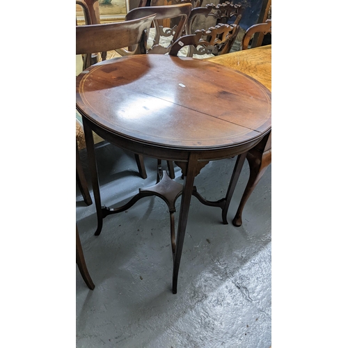 406 - Two Edwardian mahogany circular topped occasional tables on splayed legs
Location:G
If there is no c... 