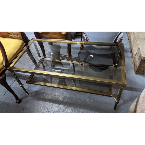 410 - A vintage brass and glass two tier coffee table on tapering reeded legs
Location:G
If there is no co... 